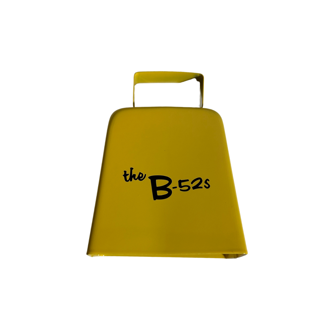 Bright yellow metal logo cowbell with the b-52s printed in black script from b-52s official merch
