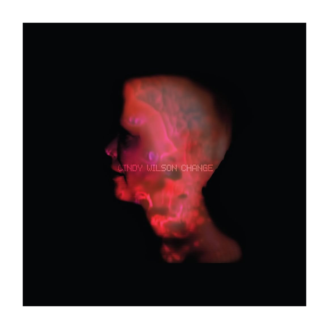 A glowing red and pink digital skull with glitchy texture on the signed change vinyl by cindy wilson b-52s