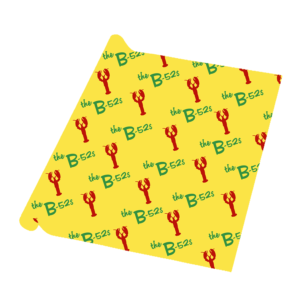 Yellow bandana or handkerchief with a repeating pattern of red lobsters and green ’the B-52s’ text.