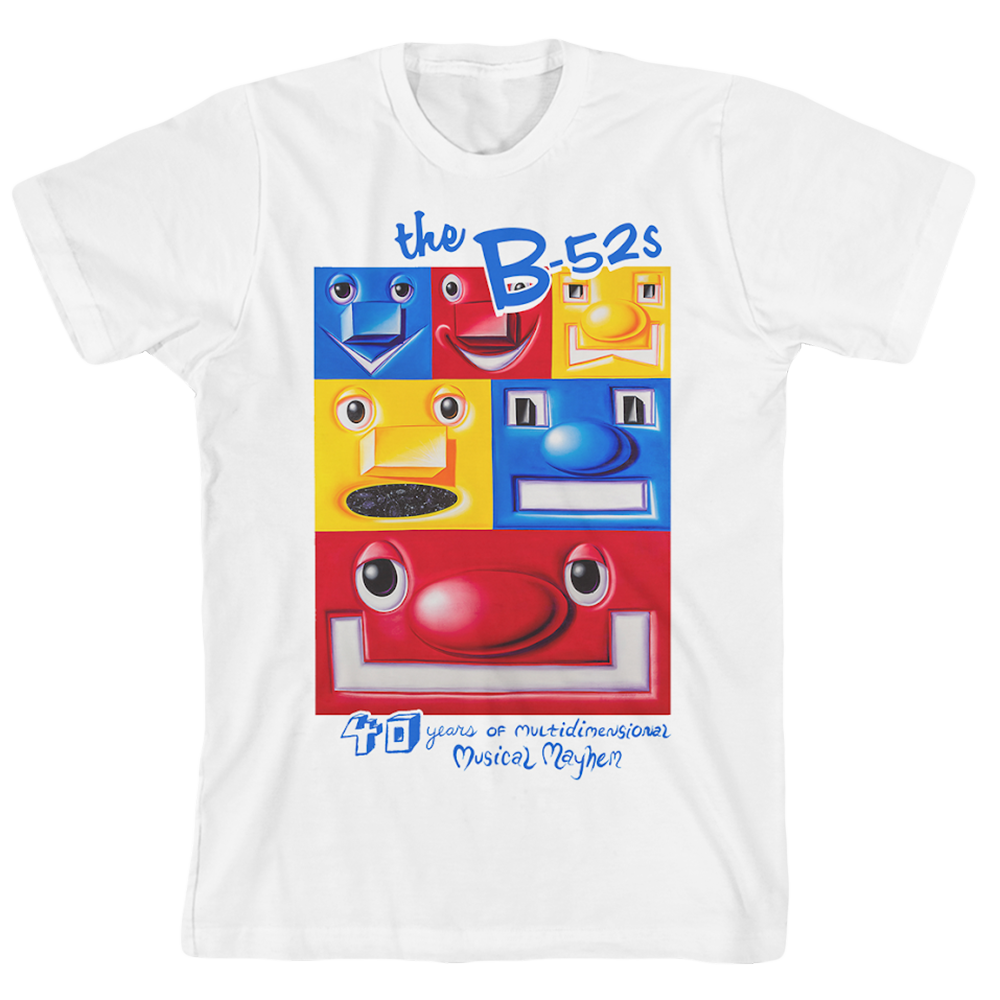 White t-shirt featuring colorful cartoon faces and text about ’The B-52s’ band.