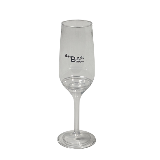 Clear glass champagne glass with the b-52s 70 years printed on the stem from b-52s official store
