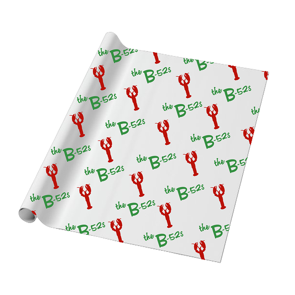 Roll of wrapping paper with a repeating pattern of ’the B-52s’ text in green and red lobster illustrations.