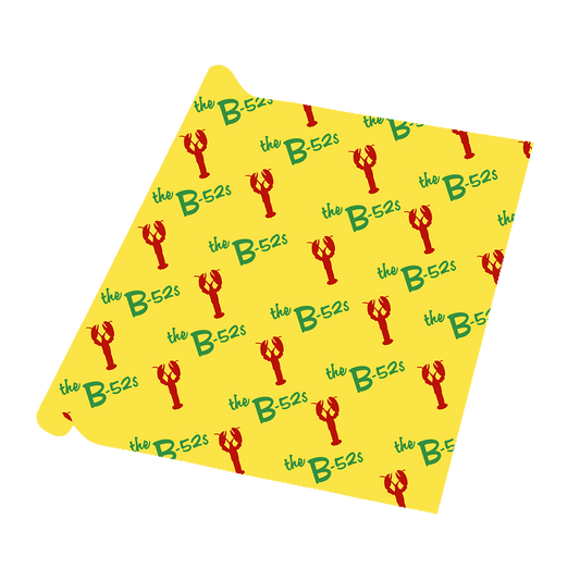 Yellow bandana or handkerchief with a repeating pattern of red lobsters and green ’the B-52s’ text.